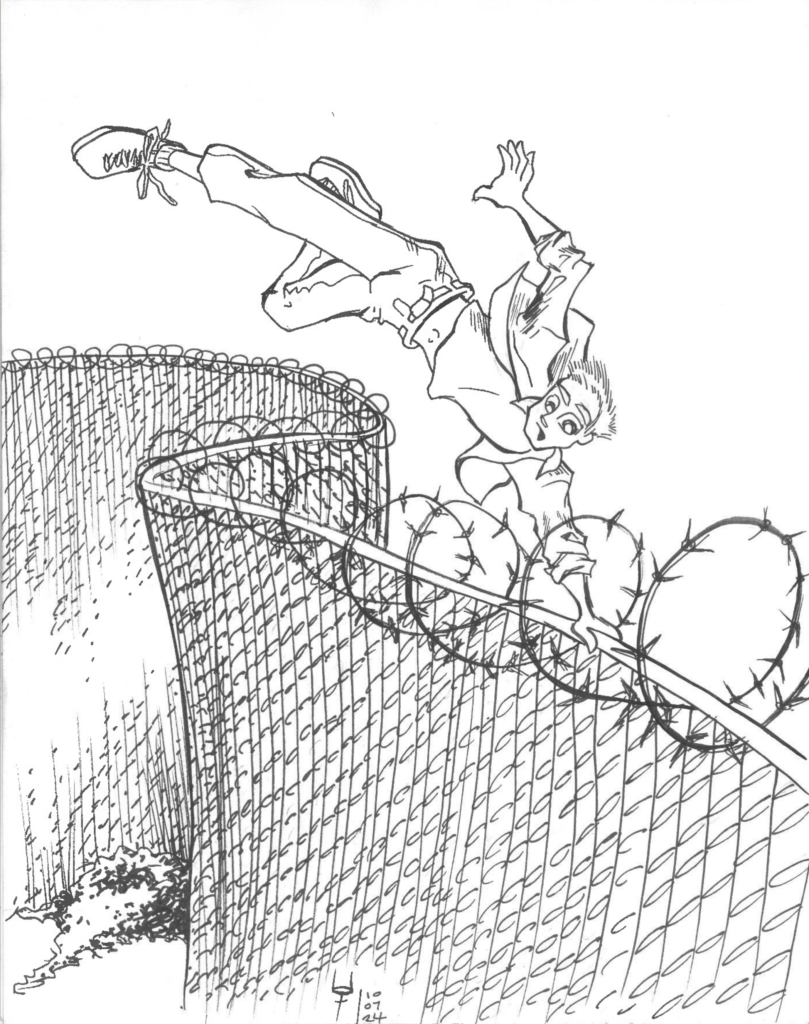 A young man is vaulting over a tall, barbed wire fence, as one would expect to see along the U.S.-Mexico border.